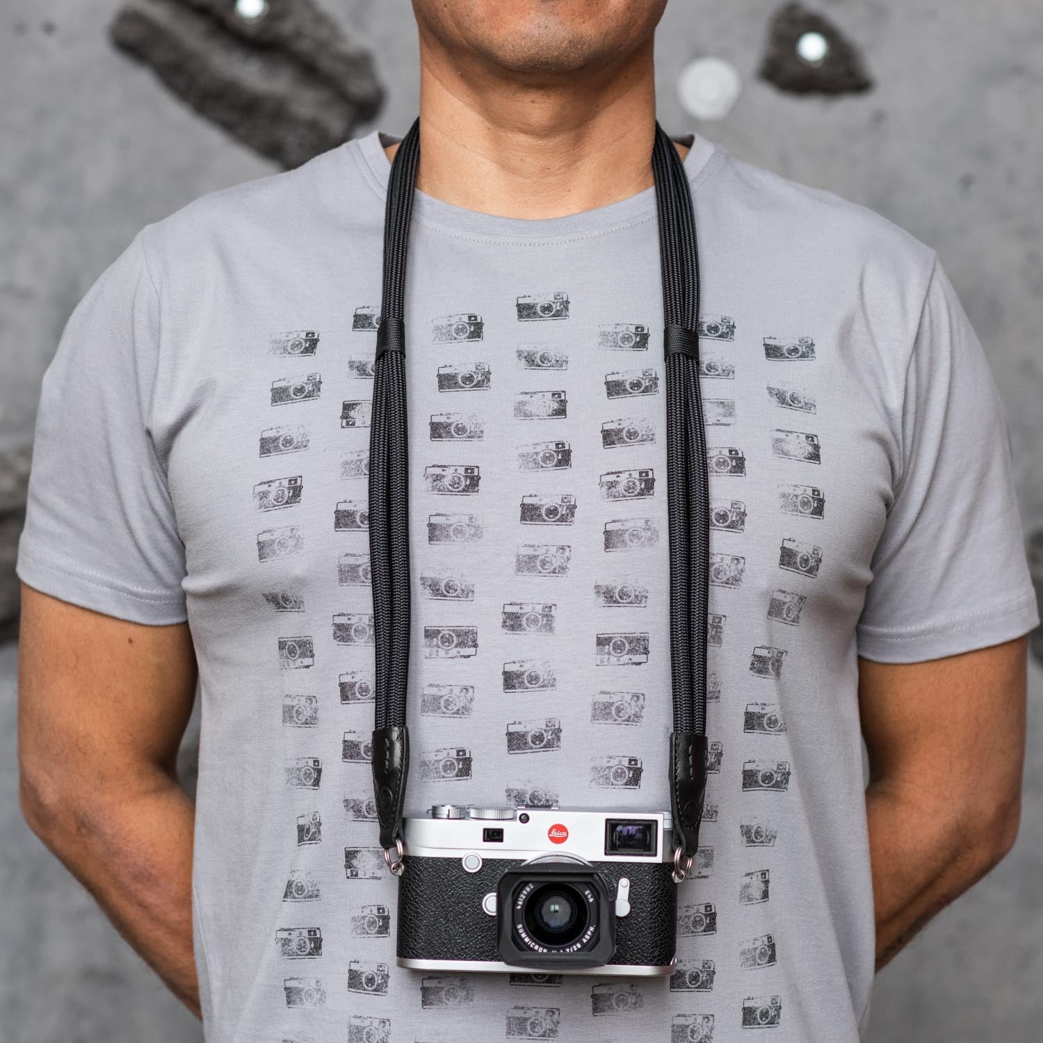 Photographer wearing Leica Double Rope Strap