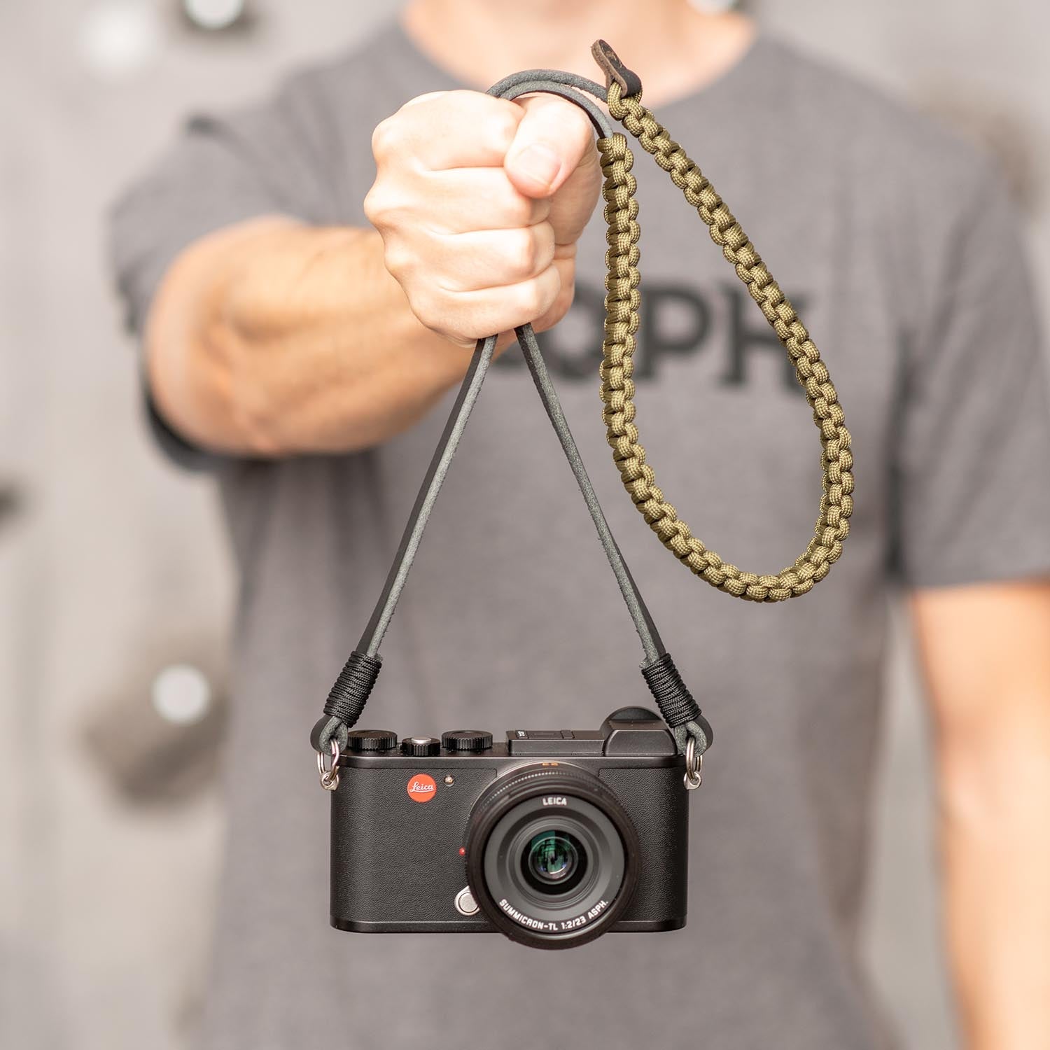 Holding camera by paracord strap